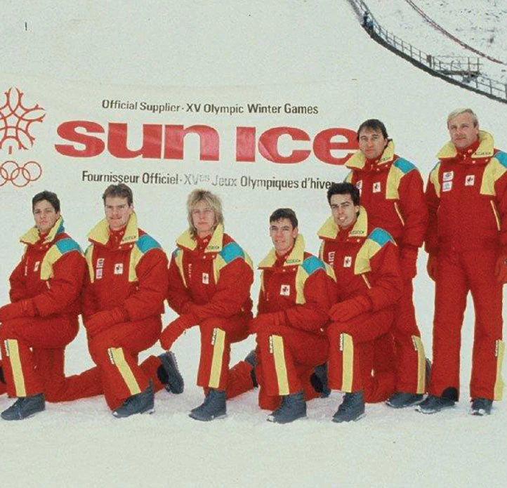 Group of people in red Olympic-themed outfits with 'sun Ice' branding on a snowy background.